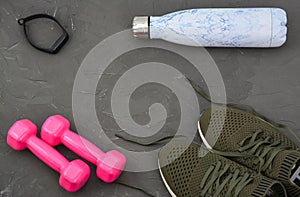 Sport shoes dumbbells, water bottle, smart watch