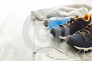 Sport shoes with energy drink and earphone