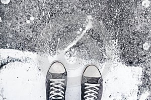 Sport shoes on street pavement