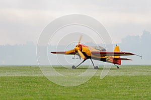 Sport single-engined airplane. Propeller plane on the lawn before take-off