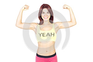 Sport smiling woman shows off his muscles . Sports and fitness c
