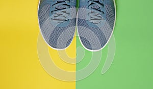 Sport sneakers on yellow green background with copy space for text. Sport objects background. Sports concept