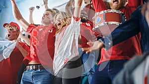Sport Stadium Big Event: Crowd of Fans Cheer for Red Soccer Team to Win. People Celebrate Scoring a