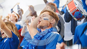 Sport Stadium Big Event: Handsome Happy Caucasian Man Emotionally Cheers, Screams. Crowd of Fans