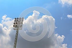 Sport stadium floodlights on a cloudy background.