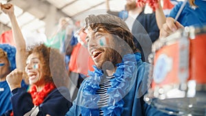 Sport Stadium Soccer Match: Portrait of Excited Hispanic Couple with Italian Flag Painted Faces