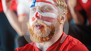 Sport Stadium Sport Event: Portrait of Handsome Man with U.S. Flag Painted Cheering for Red Americn
