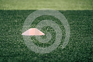 Sport training equipments marker on green outdoor soccer training field