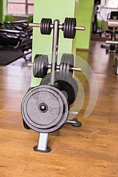 Sport, training and healthy lifestyle concept - gym interior with equipment.