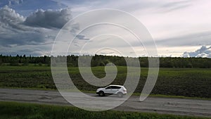 Sport utility vehicle shakes driving along grey old road