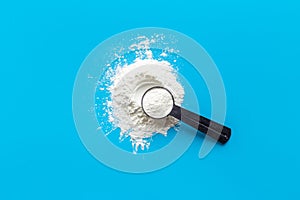 Sport whey protein powder in scoop. Sport nutrition