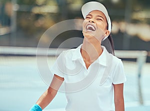 Sport, winning and tennis success with woman tennis player celebration win during a game on court. Fitness, energy and