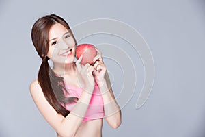 Sport woman with an apple