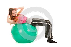 Sport woman with ball training the abs