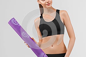 Sport woman in black slim with mat for joga