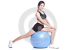 Sport woman doing stretching fitness exercise on ball