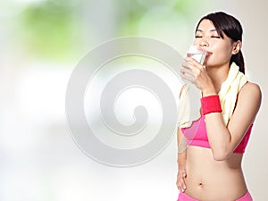 Sport woman drinking water after sport