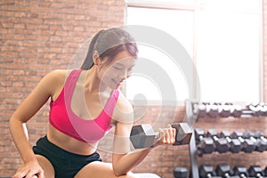 Sport woman with dumbbell