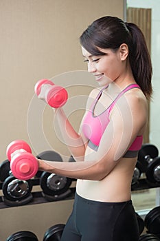 Sport woman with dumbbell