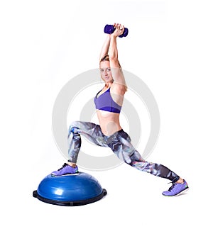 Sport woman exercise with a pilates ball and dumbbells
