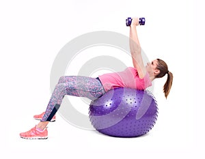 Sport woman exercise with a pilates ball and dumbbells