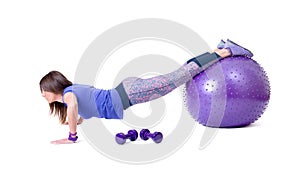 Sport woman exercise with a pilates ball and dumbbells