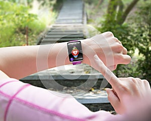 Sport woman finger pointing health sensor smart watch hand wearing