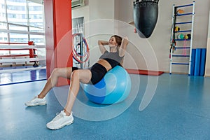 Sport woman in gym. Healthy lifestyle concept. Athletic young woman. Fitness.