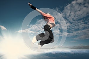 Sport woman jumping and fly over sky and sun