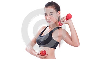 Sport woman with lifting weights and holding apple.