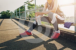 Sport woman sitting after running