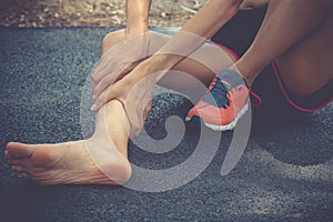 Sport woman suffering leg cramping. athlete runner training for fitness marathon hold injured shin. athletic girl muscles ankle