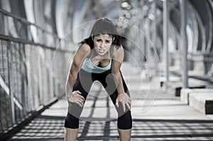 Sport woman tired and exhausted breathing and cooling down after running