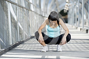 Sport woman tired and exhausted breathing and cooling down after running