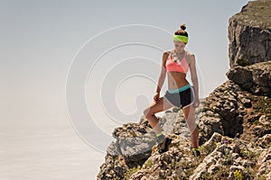 Sport Woman Traveler on a top of a mountain