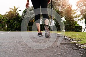 Sport woman walking towards on the road side. Step concept