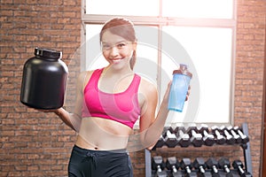 Sport woman with whey protein