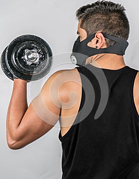 Sport, Young Athletic man exercising. Muscular and strong guy exercising