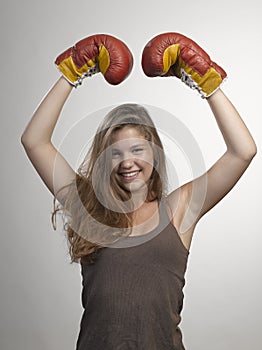 sport young woman boxing gloves, face of fitness girl studio shot