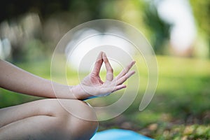 Sport young woman doing yoga exercise outdoor in the park, sport yoga concept