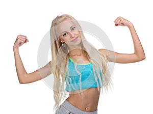 Sport young woman with perfect body showing biceps