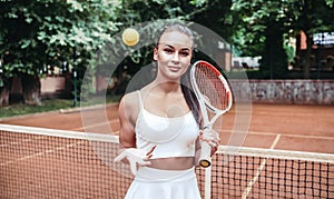 Sport young woman on tennis court. Female tennis player