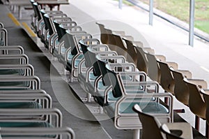 Sporting stadium spectator chairs in a row