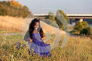 Sportive black woman in blue dress