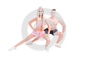 Sportive fitness couple stretching with lunge position