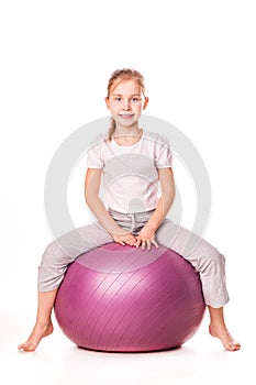 Sportive girl on a fit ball