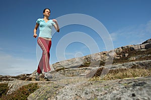 Sportive girl running outdoor