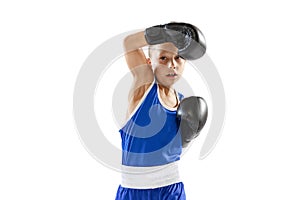 Sportive little boy, kid in boxer gloves and shorts training isolated on white studio background. Concept of sport