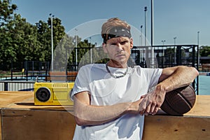 sportive man in bandana and necklace