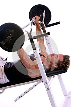 Sportive man doing Weightlifting with barbell